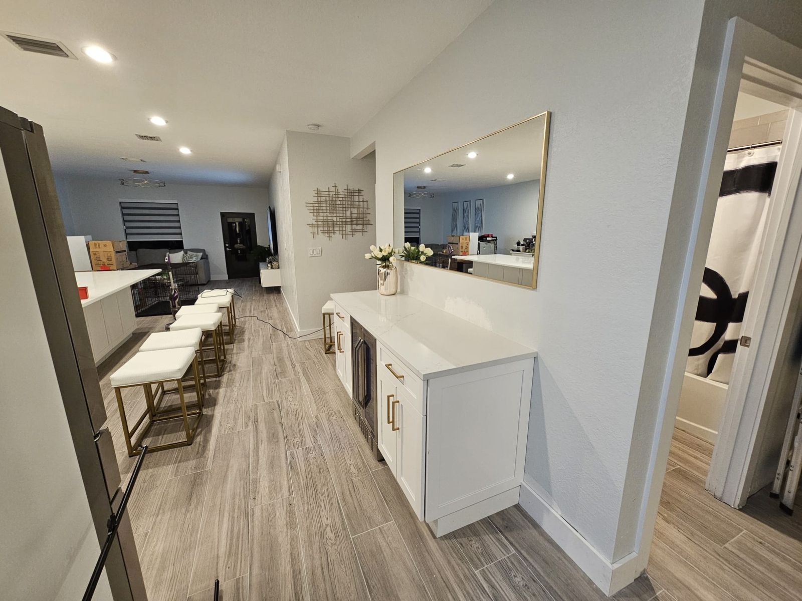 Bright white shaker kitchen with island and bar stools